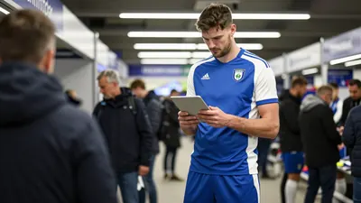 A 35-year-old, tall, and athletic-looking football scout, wearing a Barrow AFC kit (blue and white striped shirt, blue...